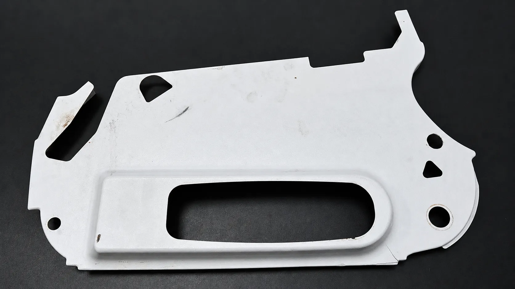 Existing white cabin panel with damage, as received for scanning