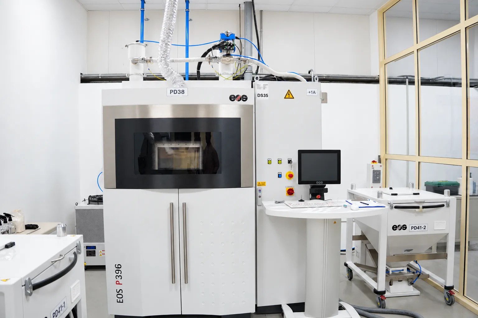 EOS P 396 laser sintering system in its room at Paradigm 3D