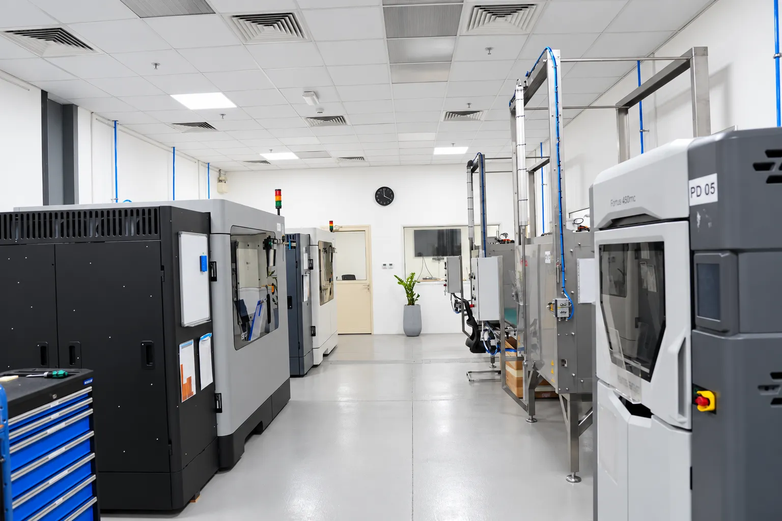 The Paradigm 3D production floor with printers along the aisle