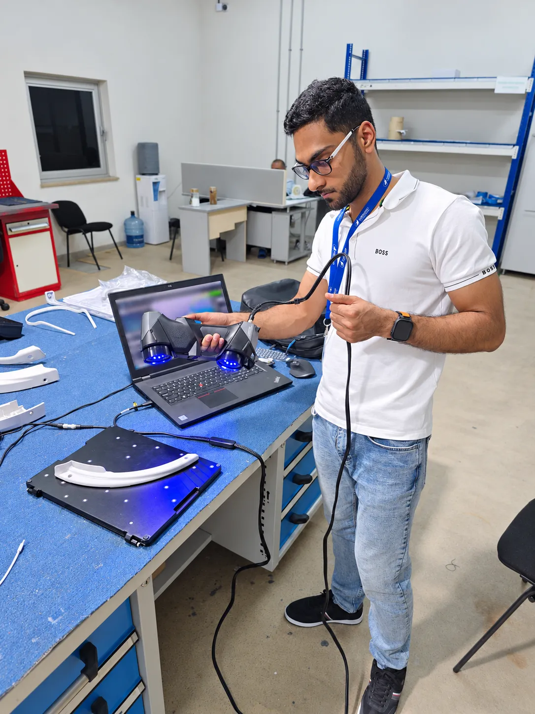 Operator scanning an aircraft cabin component