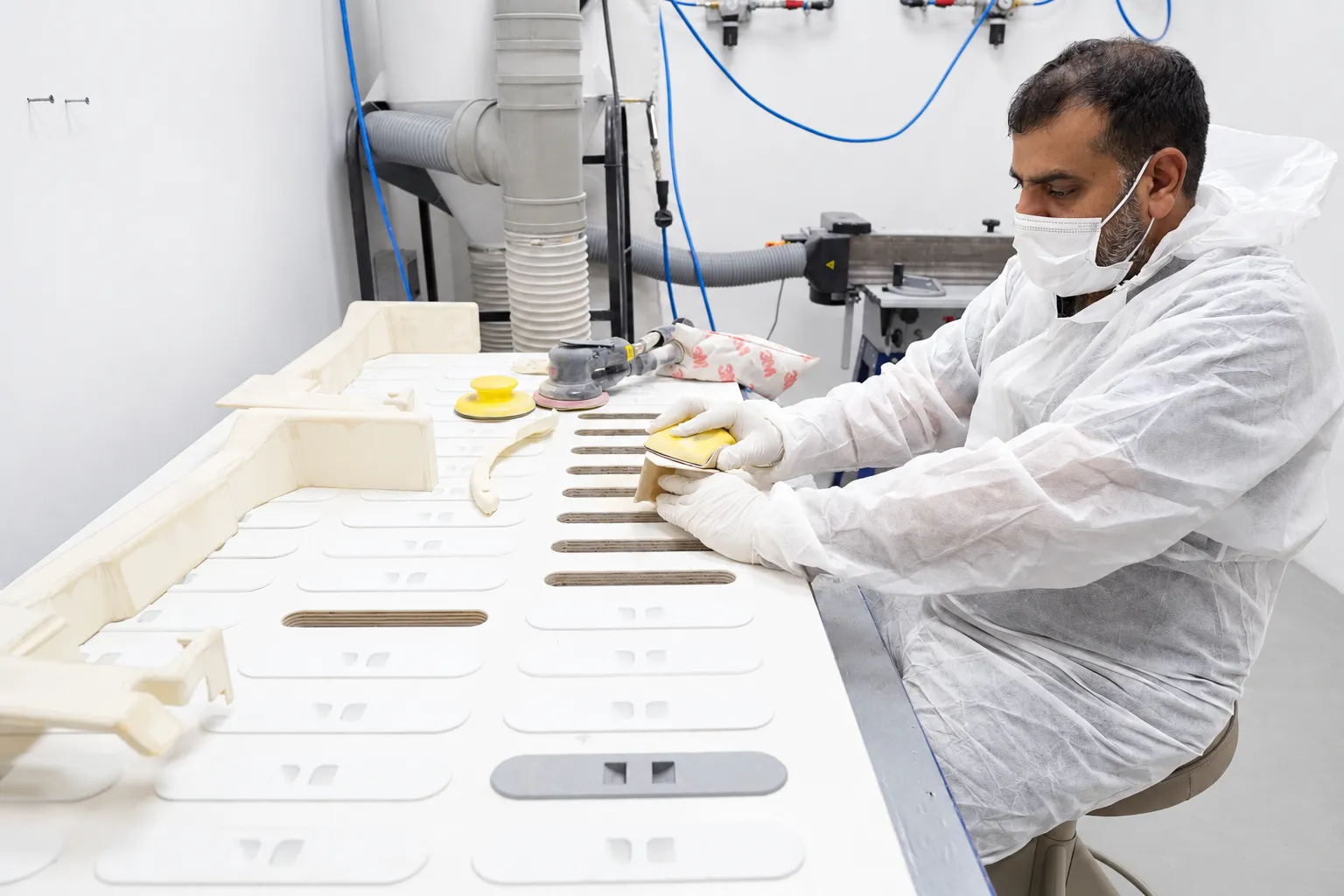 Technician preparing printed parts on a bench