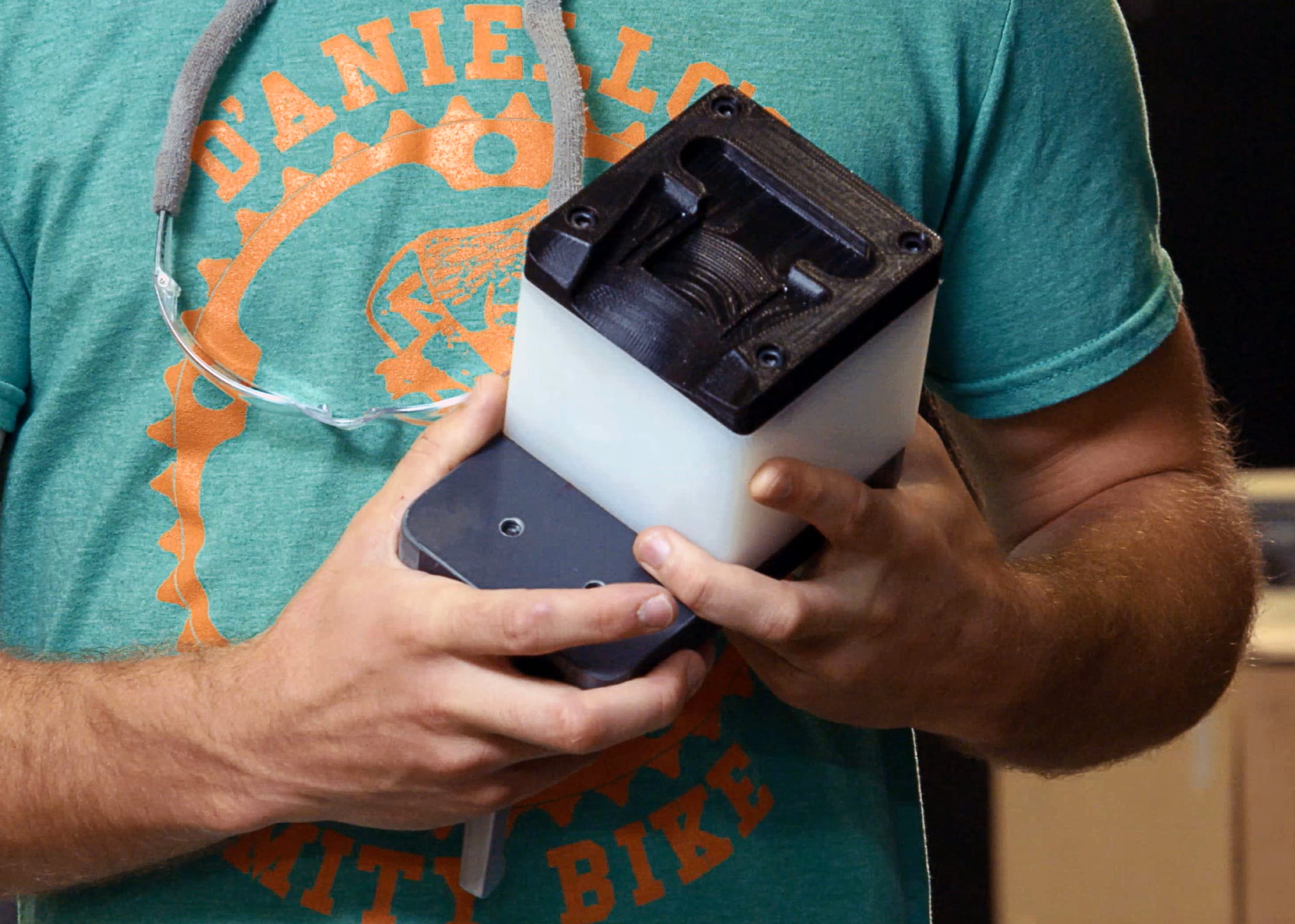 Engineer holding a functional FDM prototype housing