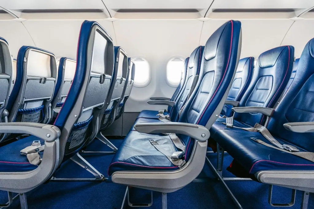 Aircraft cabin with blue passenger seats