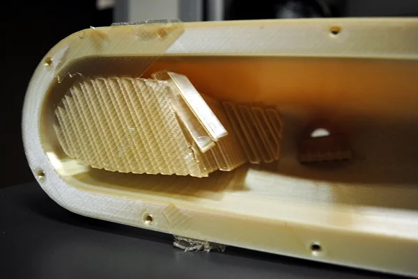 Breakaway support material being removed from inside a printed ULTEM part