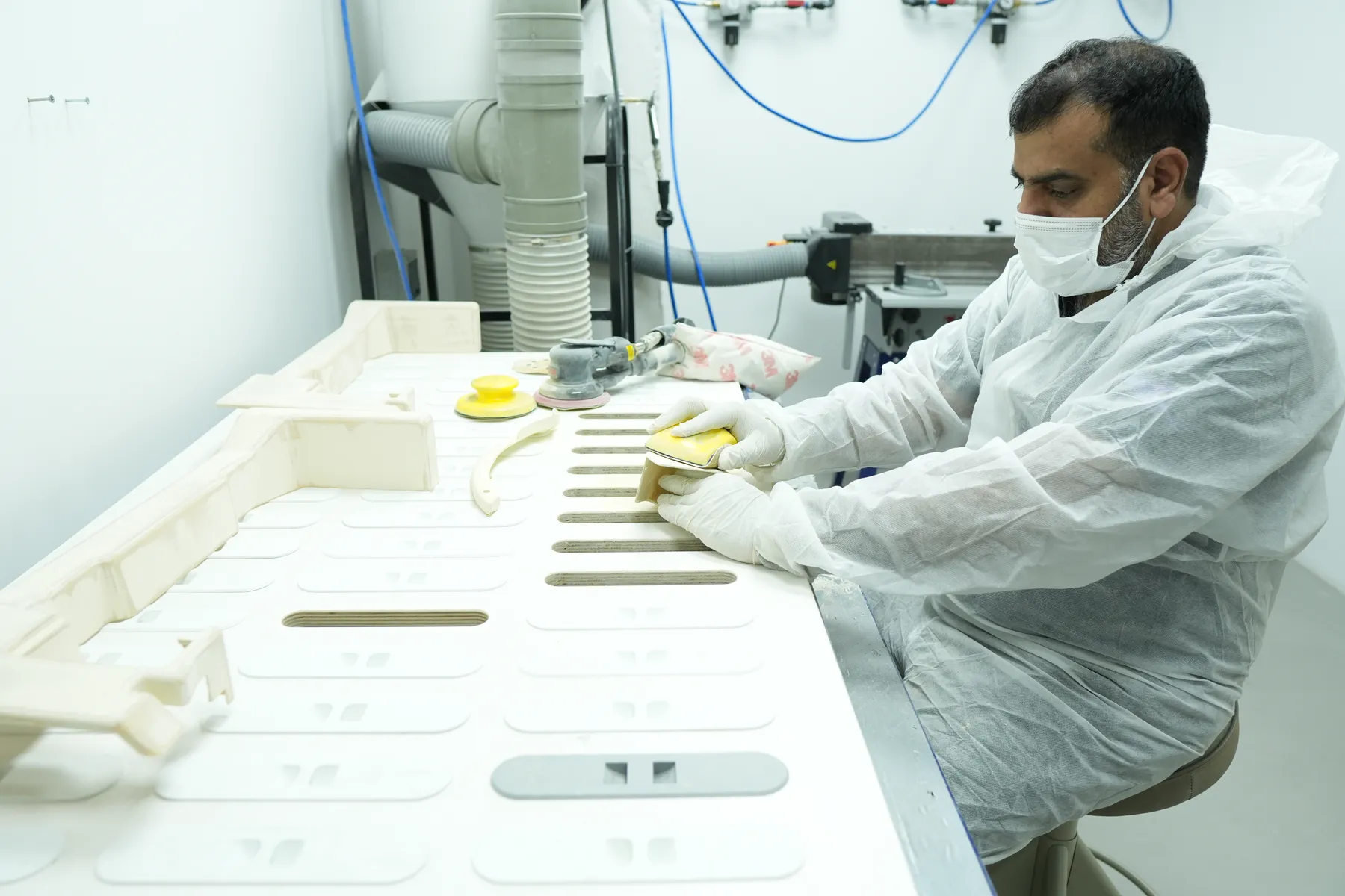 Paradigm 3D technician preparing the surface of printed parts before painting